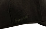 Rewired Wool Essential R Trucker Cap - Black Tonal - Side Script Logo